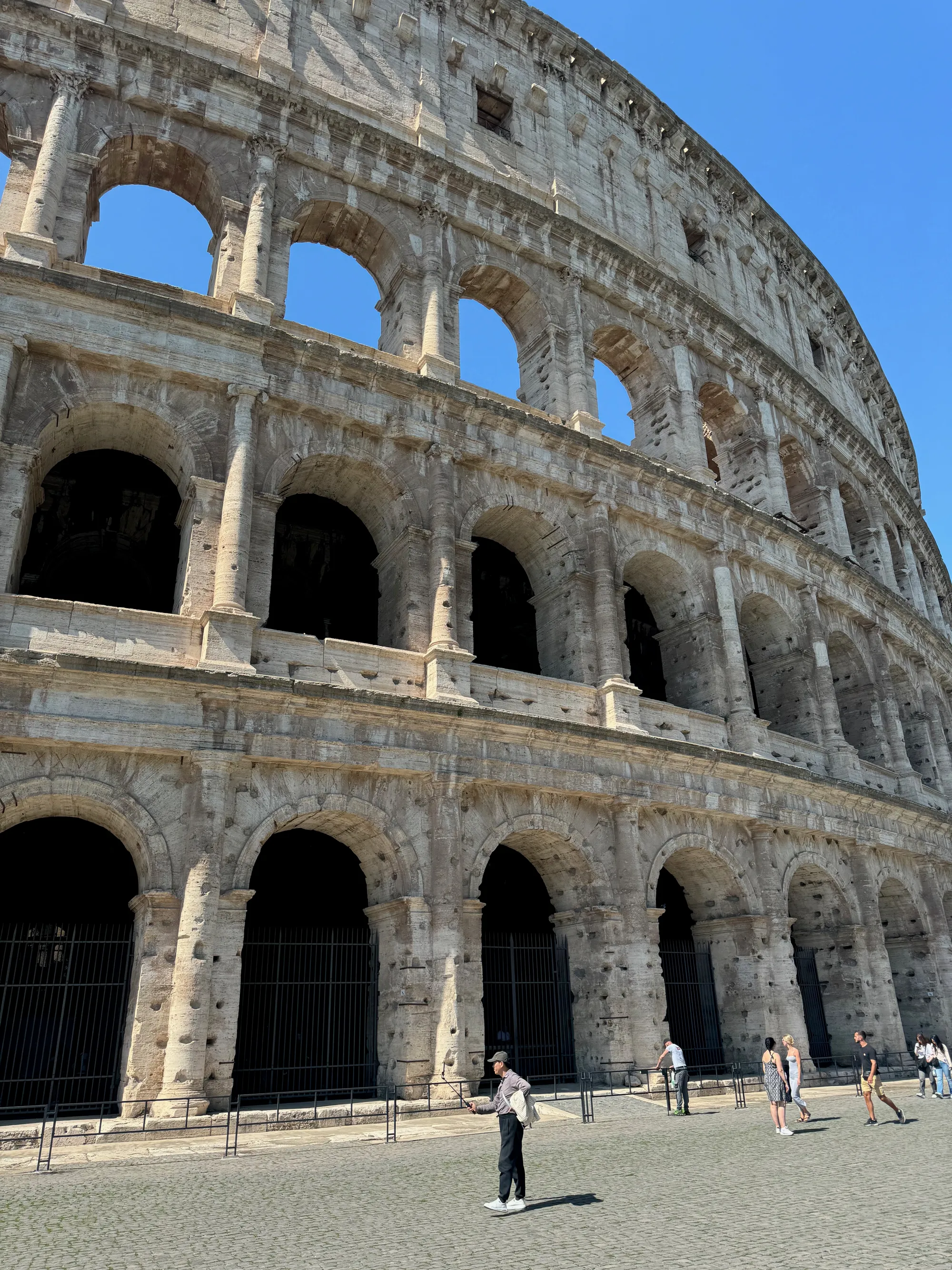 Travelers at the Colosseum